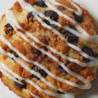 Blueberry Lemon Muffin Top · Lemon-infused batter topped with blueberries, almond crumbles, and lemon drizzle