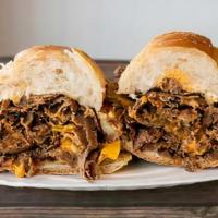 Cheese Steak W/ Pepper & Onions · Shaved Rib Eye, Grilled Peppers and Onions.  Topped with American Cheese or Cheese Sauce.