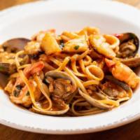 Seafood Pasta · Chucks of fish filets, shrimp, calamari, clams, garlic, red peppers, and cherry tomatoes ove...