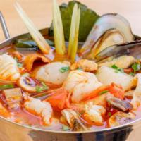 Seafood Tom Yum · Lemongrass with kaffir lime leaves, lime juice, mixed seafood & mushrooms. Hot and spicy.