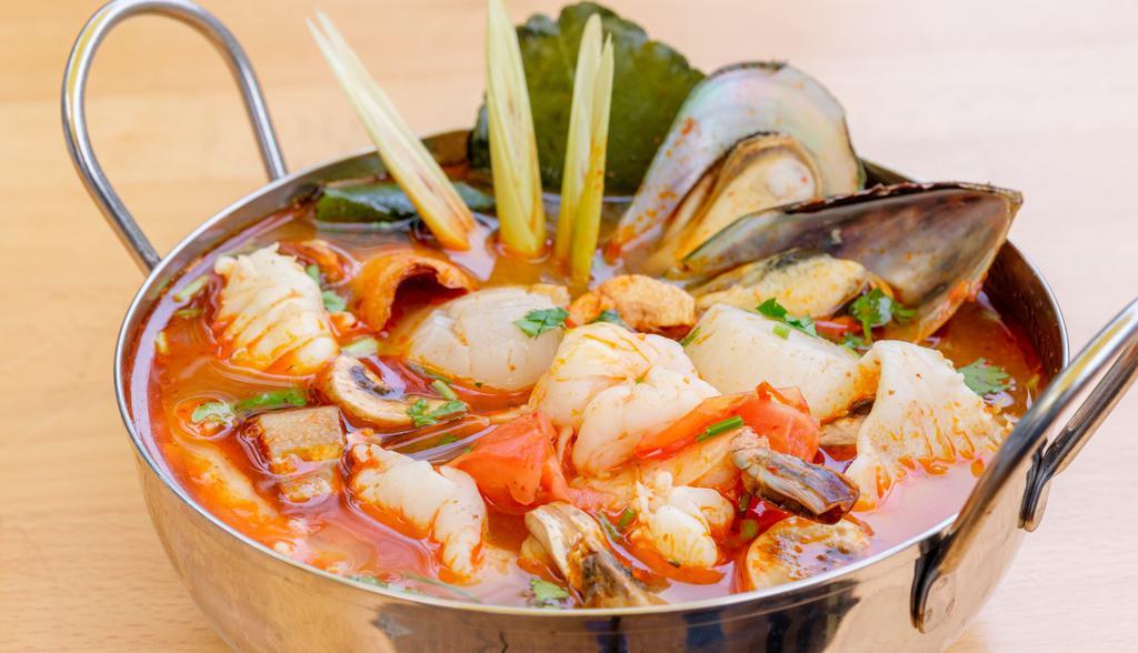 Seafood Tom Yum · Lemongrass with kaffir lime leaves, lime juice, mixed seafood & mushrooms. Hot and spicy.