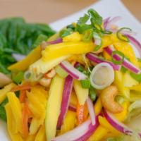 Mango Salad · Sliced mango, red onion, scallion, cashew nuts in spicy lime juice. Hot and spicy.