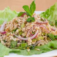 Chicken Labb · Spicy minced chicken with red onion, cilantro, mint leaves, chili and lime juice. Hot and sp...
