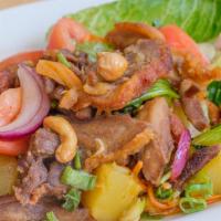 Duck Salad · Sliced roasted duck with romaine, tomato, pineapple, and cashew nuts in spicy chili lime jui...