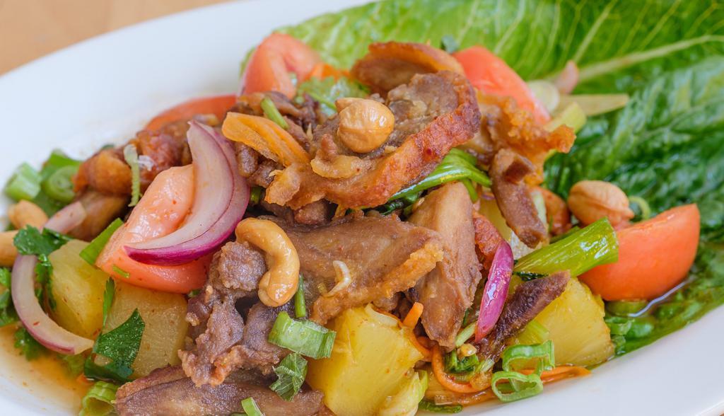 Duck Salad · Sliced roasted duck with romaine, tomato, pineapple, and cashew nuts in spicy chili lime juice. Hot and spicy.