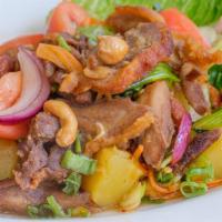 Vegetarian Duck Salad · Deep fried vegetarian duck with romaine, tomato, pineapple, and cashew nuts in spicy chili l...