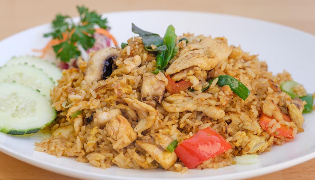 Tom Yum Fried Rice · Fried rice with choice of meat, egg, mushroom, scallion, lemongrass and chili paste. Hot and spicy.