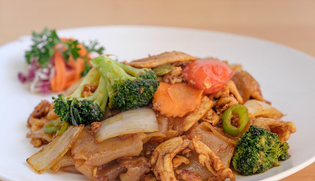 Pad Kee Mao · Sauteed wide noodles with choice of meat, chili paste and basil leaves. Hot and spicy.