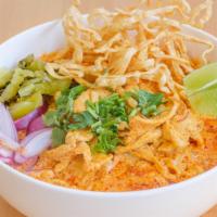 Khao Soi · Northern thai styled curry noodle soup with chicken, red onion, cilantro, dried chili and cr...