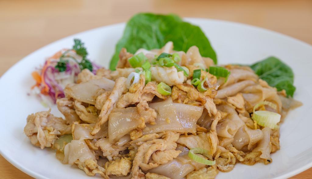 Pad Kua Gai · Sauteed wide noodles with chicken, squid and egg.