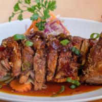 Ma Kin Duck Sam Rod · Crispy duck topped with three-flavored sauce.