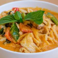 Red Curry · Bamboo shoot, fresh basil, and bell pepper in coconut milk. Hot and spicy.