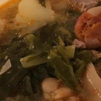 Caldo Gallego · Galician soup - collard greens, potatoes, white beans, sausage, and pork in a light broth.