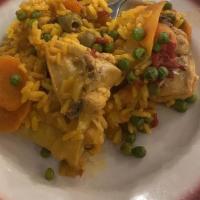 Arroz Con Pollo · Yellow saffron rice with chicken, spanish sausage, and olives.