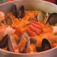 Paella De La Casa · Yellow saffron rice with chicken, sausage, mussels, clams, shrimp, and lobster piece(1 pers....