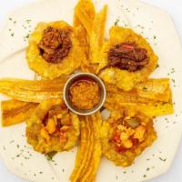 Tostones Rellenos · Fried green plantains filled with chicken sofrito, ropa vieja, picadillo, and shrimp criollo.