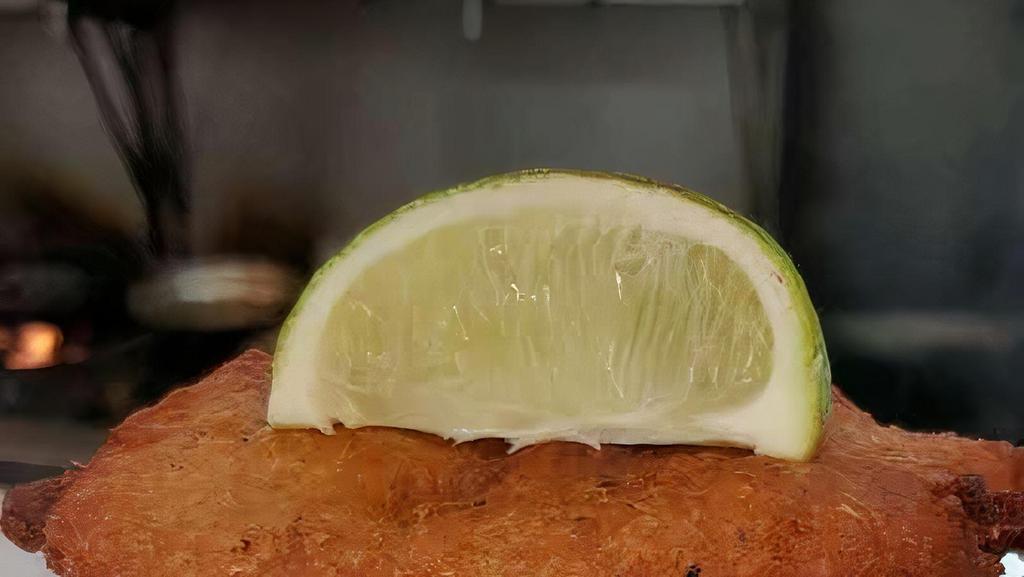 Baccalaitos · Crispy-golden salt codfish cakes, served with an avocado salsa.