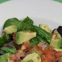 Aguacate · Avocados, cilantro, plum tomatoes, and red onions tossed in a lime-cilantro vinaigrette.