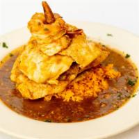Pollo Con Camarones · Boneless chicken breast and jumbo shrimp sautéed in a rioja demi-glaze. Served over saffron ...