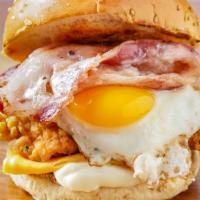 The Rise 'N Shine B*T*H · Our signature fried chicken served on a toasted bun and topped with bacon, Cheddar cheese, m...