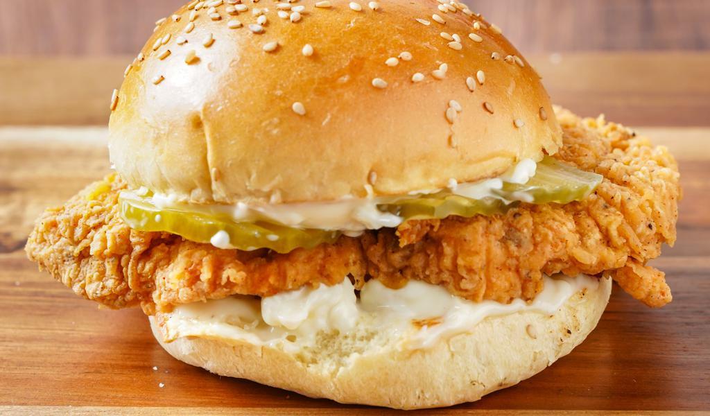 The Classic B*T*H · Our signature fried chicken served on a toasted bun and topped with pickles and mayonnaise.