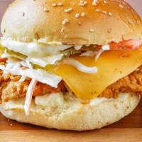 The Og B*T*H With Cheese · Our signature fried chicken served on a toasted bun and topped with coleslaw, American, pick...