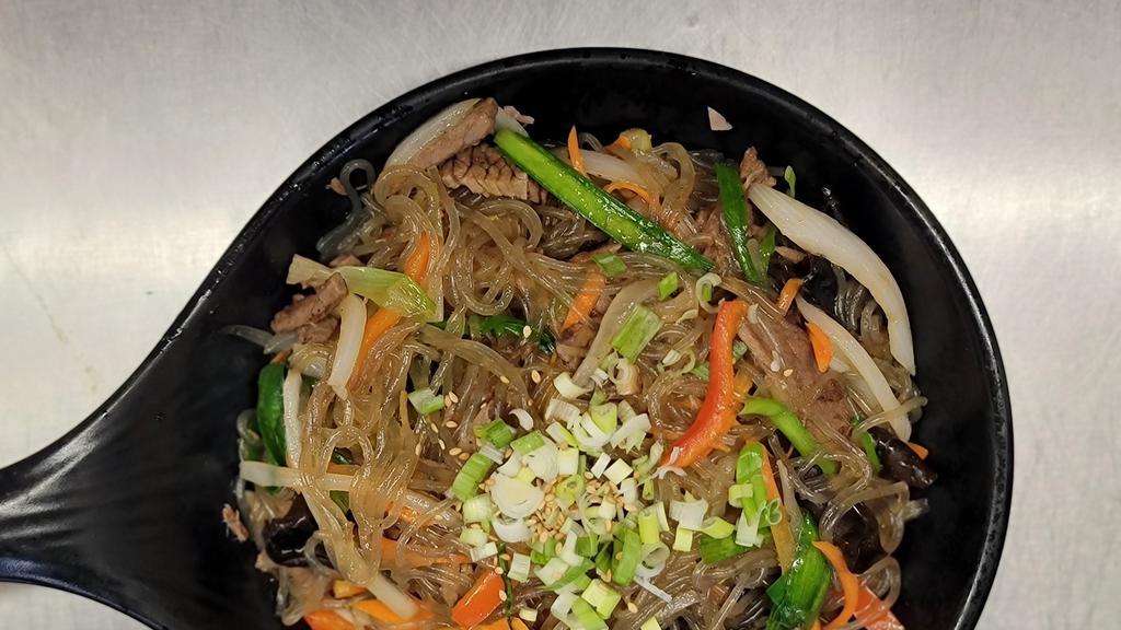 Japchae · Sautéed glass noodles with beef and vegetables.