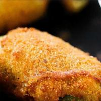 Jalapeño Poppers · Fried and breaded jalapeño with cheese filling.