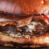 Sky Blue Burger · Beef patty, smoked bacon, caramelized onion, blue cheese, house sauce, brioche bun.