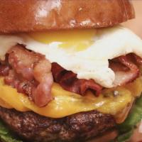 Steak And Egg Burger · Beef patty, smoked bacon, over easy egg, American cheese, chipotle mayonnaise, lettuces, tom...