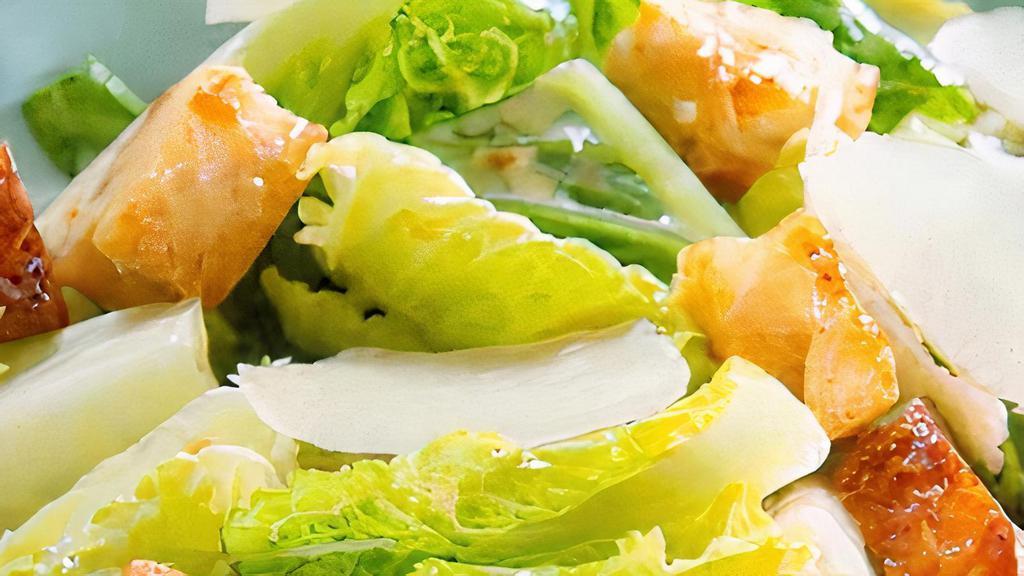 Caesar Salad · Romaine lettuces, herb chicken,  croutons, shave parmesan and old style Caesar dressing.