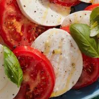 Caprese Salad · Buffalo mozzarella, sliced tomatoes, oregano, baby arugula, balsamic glazed, extra virgin ol...