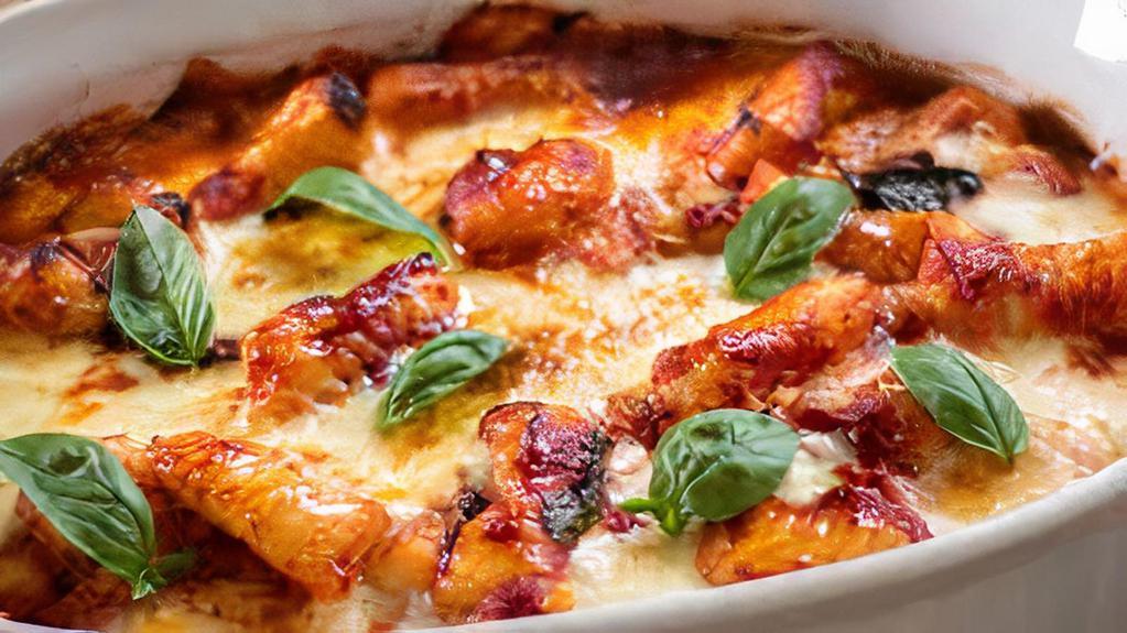 Gnocchi Alla Sorrentina · Homemade potato dumpling, mozzarella and parmesan cheese, tomato sauce and fresh basil.