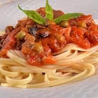 Fettuccine Al Pomodoro · Roasted cherry tomatoes, sweet garlic, homemade tomato sauce.