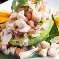 Ceviche De Pescado · Fish marinated in lime juice and hot peppers.