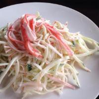 Kani Salad · Crab meat, cucumber, and masago in mayonnaise dressing.