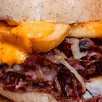 The Taste Master Sandwich · Mounds of juicy pastrami and corned beef, topped with prime bacon, grilled onions, a few ste...