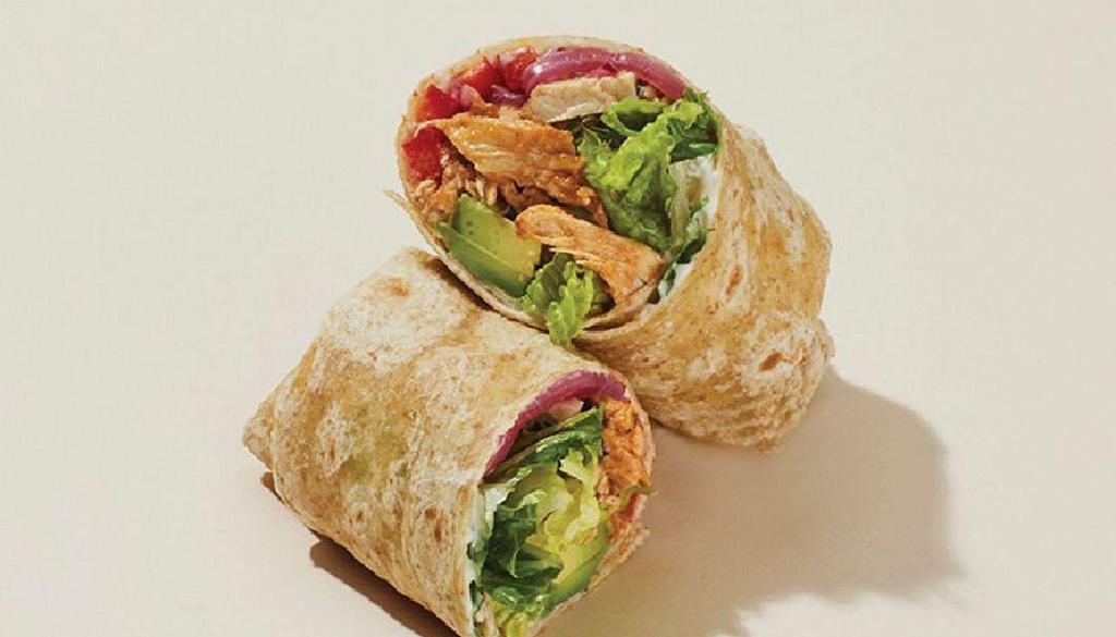 Crunchy Chipotle Chicken & Avo Wrap · Grilled chicken (ABF), red peppers, pickled red onions and avocado nestled in a bed of romaine and cilantro, drizzled with mayo, yogurt and a chipotle-flavored sauce, rolled into a 7-grain wrap.
