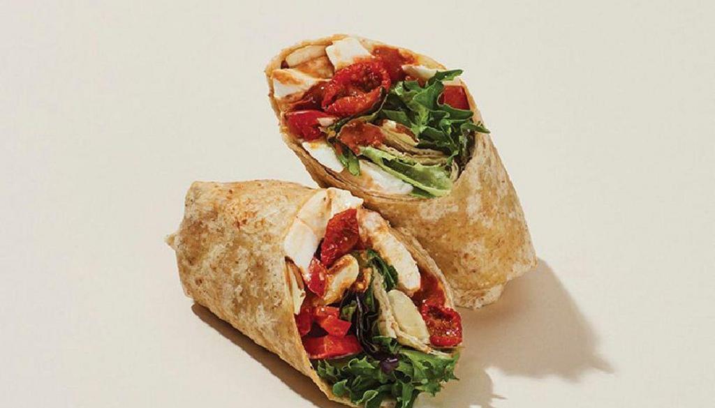 Mozzarella & Red Peppers With Romesco Wrap · Mozzarella, roasted tomatoes, red peppers, sliced almonds, mesclun, and basil with a hearty Romesco sauce, cage-free mayo, and chili salt rolled into a 7-grain wrap.