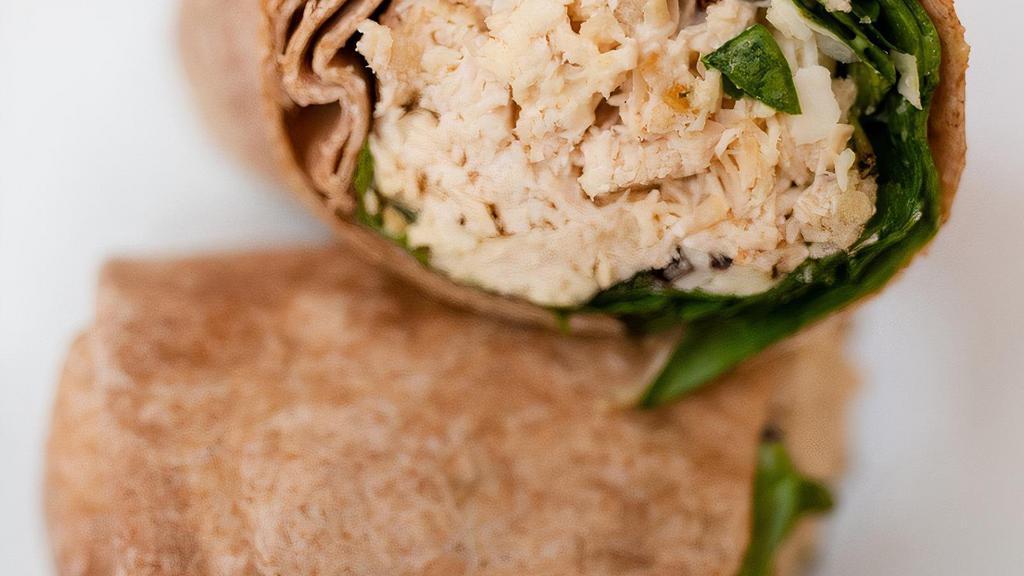 Grilled Chicken Caesar · Grilled chicken breast with seasonal greens, parmesan cheese, croutons, and caesar dressing on a whole wheat wrap.