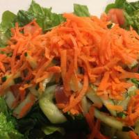Garden Salad · Seasonal greens with tomatoes, carrots, cucumbers, and choice of dressing