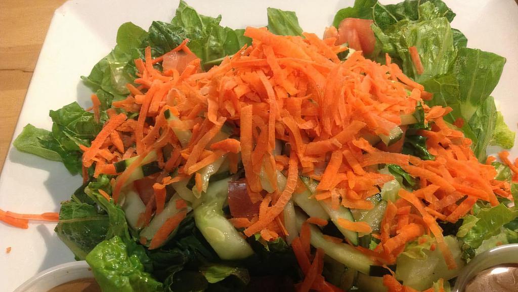 Garden Salad · Seasonal greens with tomatoes, carrots, cucumbers, and choice of dressing