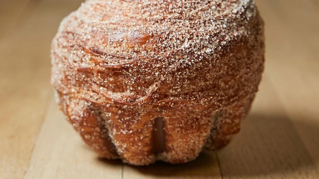 Cinnamon Sugar Roule · Our traditional croissant, baked in a fluted mold, and tossed with cinnamon sugar.
