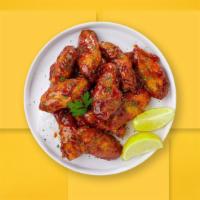 Bee'S Bbq Wings · Fresh chicken wings breaded, fried until golden brown, and tossed in honey and barbecue sauc...