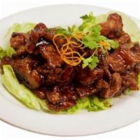 Malaysian Bbq Pork Chop 排骨王 · Authentic sweet and tangy Malaysian BBQ glaze. Served with rice.
