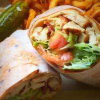 Grilled Chicken Wrap · with roasted red and green peppers, sautéed onions and garlic sauce.
