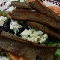 Mediterranean Salad · sliced gyro meat, mixed greens, tomatoes, feta cheese and red onion.