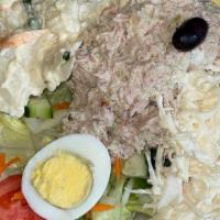 Nicoise Salad · individual tuna on a bed of organic salad with tomato, cucumber, mushrooms, hard boiled eggs...