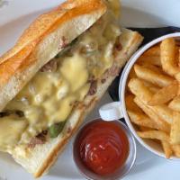 Filet Mignon Philly Cheesesteak Sandwich · Onion, peppers, and house cheese sauce.