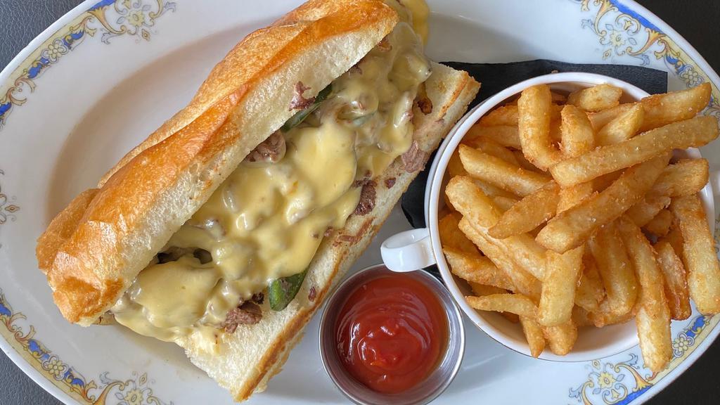 Filet Mignon Philly Cheesesteak Sandwich · Onion, peppers, and house cheese sauce.